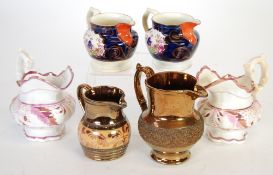 PAIR OF 19th CENTURY SUNDERLAND LUSTRE POTTERY JUGS decorated with floral bands (one handle re-