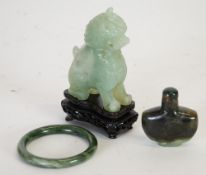 THREE PIECES OF MODERN ORIENTAL CARVED GREEN HARDSTONE, COMPRISING;  Dog of Fo, 4 1/4"" (10.8cm)