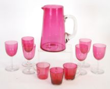 TEN PIECES OF NINETEENTH CENTURY AND LATER CRANBERRY GLASS comprising; TAPERING JUG, 7 1/2"" (19cm)