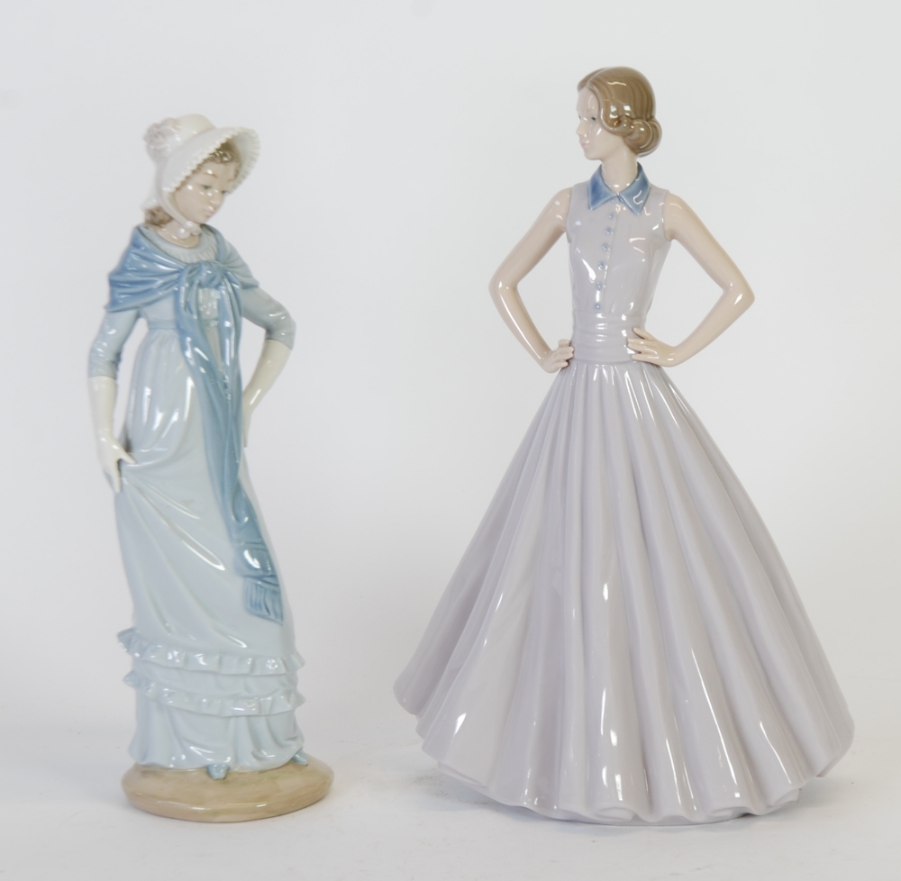 TWO NAO, SPANISH PORCELAIN FIGURES, young woman wearing a bonnet, 12¼"" (31.1cm) high and young