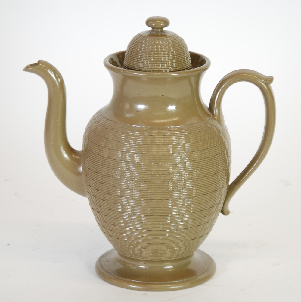 LATE NINETEENTH CENTURY WEDGWOOD CANE-WARE POTTERY PEDESTAL COFFEE POT, of footed ovoid form with