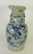 NINETEENTH CENTURY CHINESE CELADON GLAZED TWO HANDLED PORCELAIN VASE, of oviform with moulded shi-