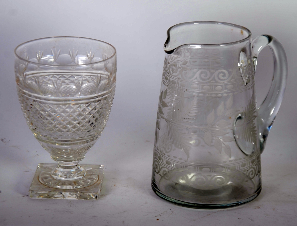 VICTORIAN ENGRAVED GLASS JUG of tapering form, wheel cut with scrollwork and foliage, 6 1/2"" (16.