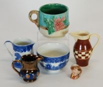 NINETEENTH CENTURY MAJOLICA MUG, embossed with flowers, TOGETHER WITH A FENTON BLUE AND WHITE CREAM