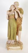 AN EARLY TWENTIETH CENTURY ROYAL DUX PORCELAIN GROUP OF A COURTING COUPLE, in classical robes,