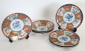 GOOD QUALITY SET OF FOUR MODERN IMARI PORCELAIN SOUP PLATES AND MATCHING PLATES, the centres