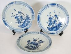 *PAIR OF CHINESE BLUE AND WHITE PORCELAIN WALL PLAQUES, painted with birds on boughs, within cross