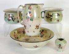 FIVE PIECE EARLY TWENTIETH CENTURY LUSTRE PORCELAIN TOILET SET, printed  with perched birds on pale