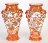 A PAIR OF JAPANESE LATE MEIJI PERIOD KUTANI PORCELAIN INVERTED BALUSTER SHAPE VASES, with mythical