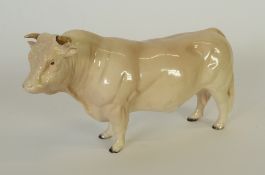 A BESWICK CHINA MODEL OF A CHAROLAIS BULL, cream gloss, 5"" (12.7cm) high, horn chipped, printed