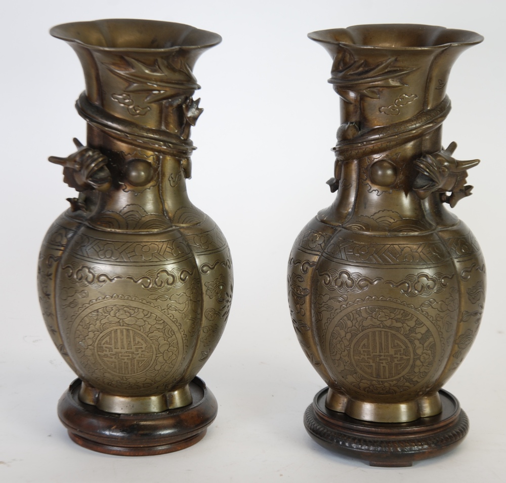PAIR OF TWENTIETH CENTURY ORIENTAL PATINATED METAL VASES, of lobated baluster form with five toed