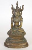 AGED FAR EASTERN CAST BRONZE FIGURE OF A BUDDHA,  modelled seated, with elaborate   headdress, on