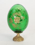 19TH CENTURY ENGRAVED GREEN GLASS EGG SHAPED ORNAMENT, wheel cut with flowers and crosshatched