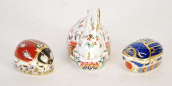 THREE MODERN ROYAL CROWN DERBY ANIMAL PATTERN IMARI CHINA PAPERWEIGHTS WITH GILT STOPPERS, `Meadow