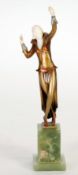 ART DECO GILT BRONZE AND IVORY FIGURE OF A FEMALE DANCER, modelled in stylised pose, on an oblong