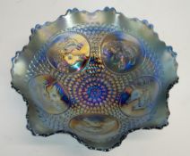A FENTON BLUE CARNIVAL GLASS, HORSE MEDALLION DISH, with wavy edge and raised on three scroll feet,