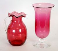 NINETEENTH CENTURY CRANBERRY GLASS LARGE JUG, of oviform with wavy rim and clear loop handle, 8"" (