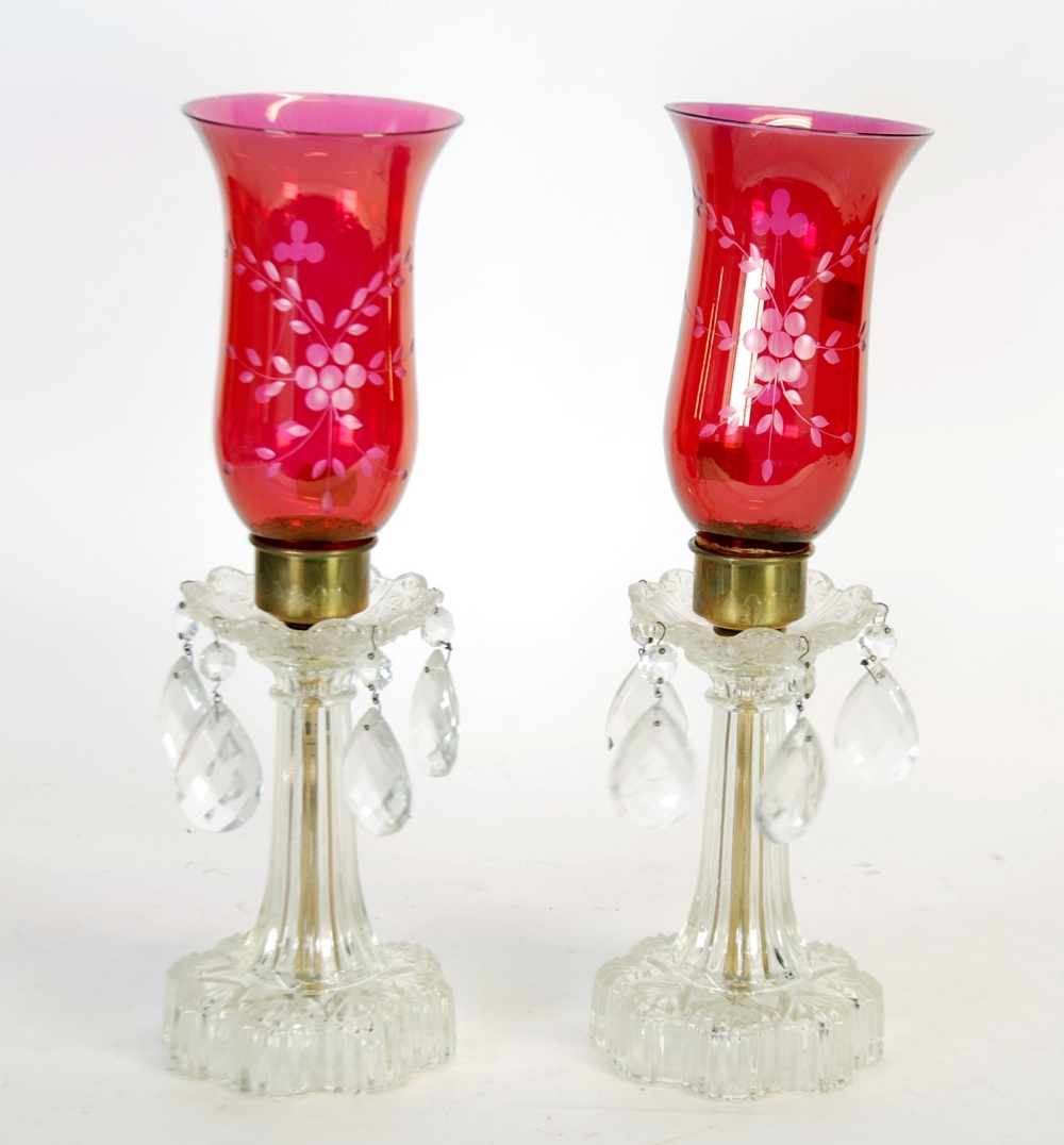 PAIR OF MOULDED GLASS TABLE LUSTRES with floral engraved cranberry glass shades and tear shaped