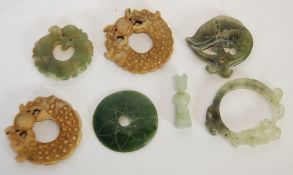 SIX MODERN ORIENTAL CARVED HARDSTONE CIRCULAR PENDANTS, including a PAIR MODELLED AS  STYLISED