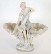 AN EARLY TWENTIETH CENTURY ROYAL DUX PORCELAIN FLOWER HOLDER IN THE FORM OF A DRAPED FEMALE FIGURE,