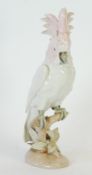 A POST WAR ROYAL DUX PORCELAIN MODEL OF A COCKATOO perched on a bough, pink triangle and printed