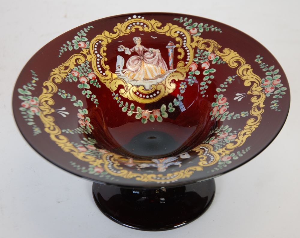 VENETIAN RUBY GLASS AND ENAMELLED TAZZA, the bowl decorated in colours  and gilt with figural