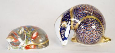 TWO MODERN ROYAL CROWN DERBY ANIMAL PATTERN IMARI CHINA PAPERWEIGHTS WITH GILT STOPPERS, badger and