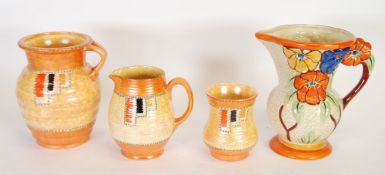 THREE PIECES OF CROWN DUCAL UNSIGNED TUBE-DECORATED POTTERY, viz   TWO JUGS and a SMALL VASE, also