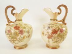 PAIR OF LATE NINETEENTH CENTURY ROYAL WORCESTER BLUSH CHINA EWERS OF FOOTED BALUSTER FORM WITH