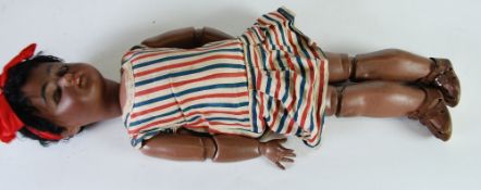 AN EARLY TWENTIETH CENTURY GERMAN SIMON AND HALBIG BISQUE HEAD MULATTO DOLL, numbered 1098?, having