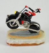 WARNER BROS. HAND PAINTED RESIN AND METAL FIGURE OF `HARLEY QUINN` DEPICTED DOING A WHEELIE ON HER
