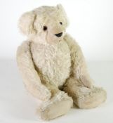 LARGE WHITE/BLOND MOHAIR TEDDY BEAR, straw filled, the swivel head having glass eyes, plush fabric