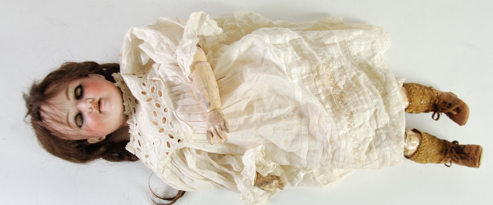 AN EARLY TWENTIETH CENTURY GERMAN ARMAND MARSEILLE BISQUE HEAD DOLL, numbered 890, having sleeping