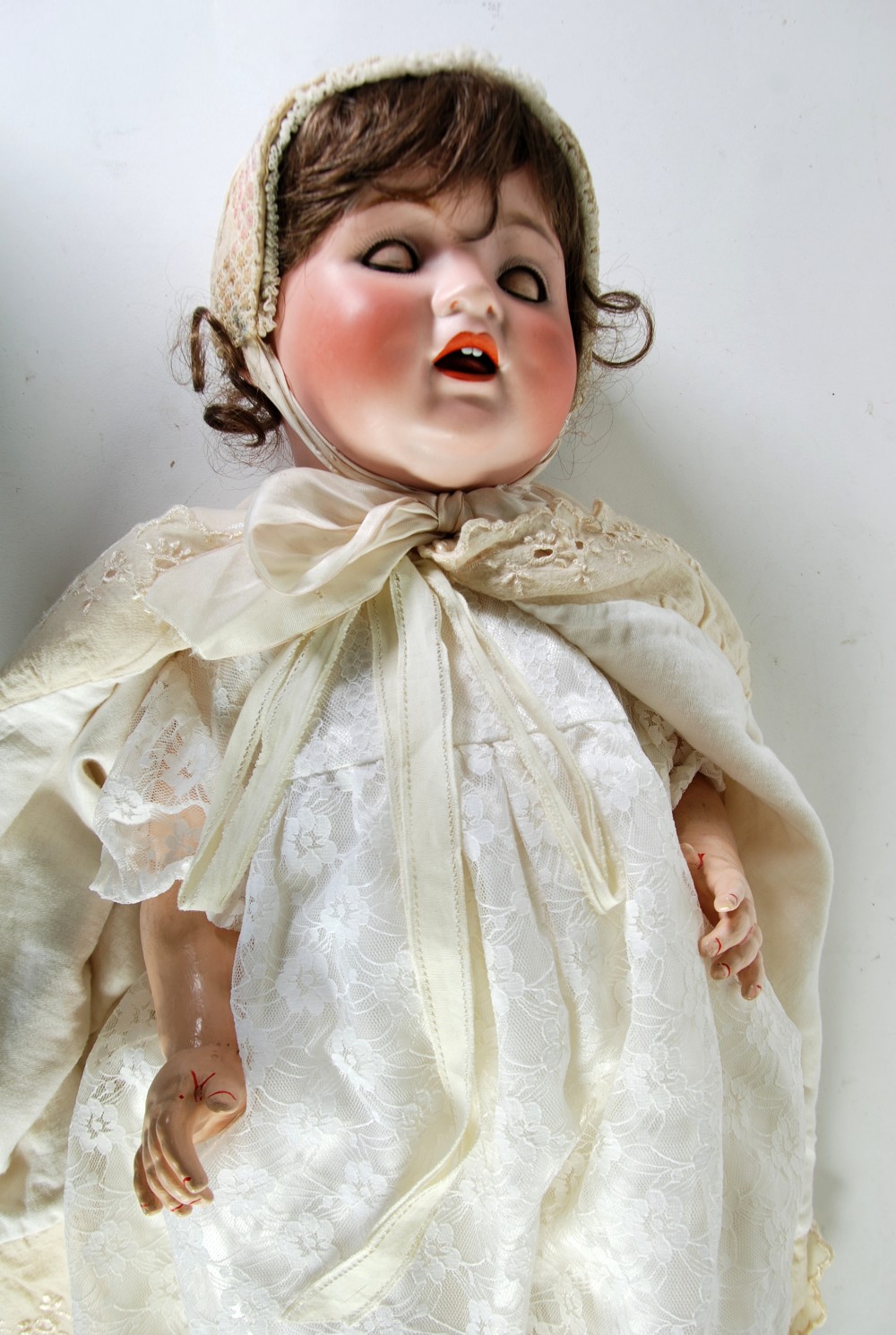 A `CATTERFELDER PUPPENFABRIK` GERMAN BISQUE HEADED GIRL BABY DOLL, by  `Kestner` brown glass