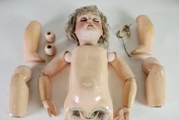 A LARGE EARLY TWENTIETH CENTURY GERMAN MAX HANDWERCK BISQUE HEAD DOLL, having sleeping hazel-brown