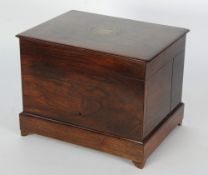 A LATE 19TH CENTURY ROSEWOOD LIQUEUR BOX OR TANTALUS with lift up top joined to the hinged locking