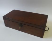 EARLY NINETEENTH CENTURY MAHOGANY PORTABLE WRITING SLOPE, of typical form with brass side handles,