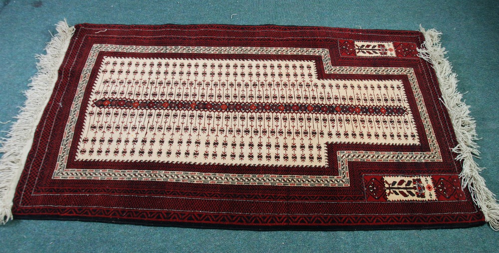 TURKOMAN `JOI NAMAZ` OR PRAYER RUG, the rectangular mihrab having a ladder stripe pattern on a