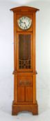 EARLY TWENTIETH CENTURY ARTS AND CRAFTS CARVED OAK LONGCASE CLOCK, the 9"" silvered Arabic dial