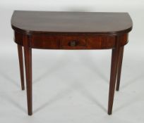 EARLY NINETEENTH CENTURY MAHOGANY FOLD OVER TEA TABLE, the `D` shaped top with reeded edge above a