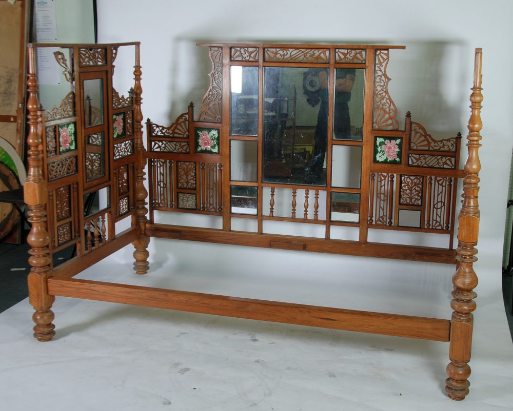 IMPRESSIVE INDIAN CARVED AND PIERCED TEAK THREE SIDED DAY BED, ornately decorated with panels