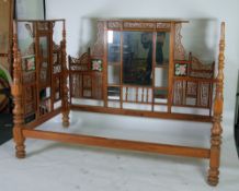 IMPRESSIVE INDIAN CARVED AND PIERCED TEAK THREE SIDED DAY BED, ornately decorated with panels
