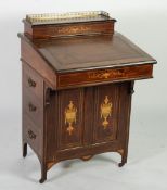 A LATE VICTORIAN ROSEWOOD AND MARQUETRY INLAID DAVENPORT DESK, the stationery box with three-