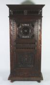 LATE NINETEENTH/EARLY TWENTIETH CENTURY FLEMISH CARVED OAK CUPBOARD, the moulded cornice above a
