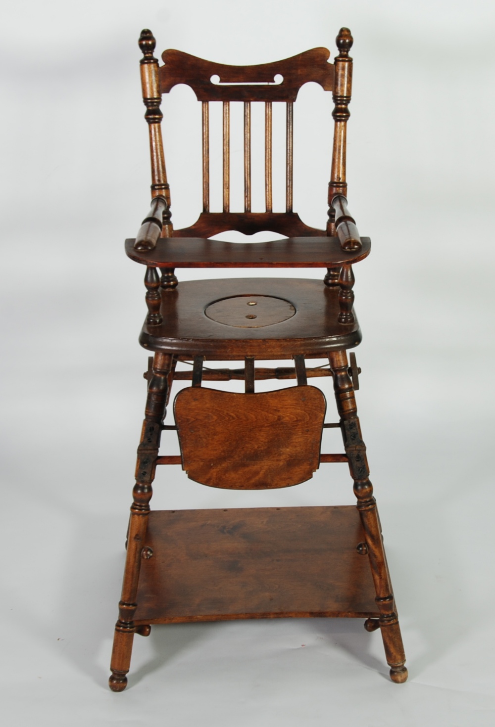 LATE NINETEENTH CENTURY CHILD`S STAINED BIRCH STICK BACK METAMORPHIC HIGH CHAIR, FORMING A TRAY