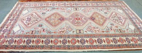 SHIRVAN SEMI ANTIQUE CAUCASIAN CARPET, with a five section pole medallion on a sky blue field
