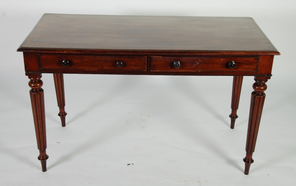 VICTORIAN MAHOGANY WRITING TABLE, the one piece moulded oblong top above a pair of cockbeaded