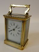 A 20TH CENTURY BRASS CASED TIMEPIECE CARRIAGE CLOCK, with white enamel dial, 5 1/2"" (14cm) high