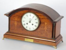 EDWARDIAN INLAID MAHOGANY PRESENTATION MANTEL CLOCK, the 4 3/4"" enamelled roman dial, powered by a