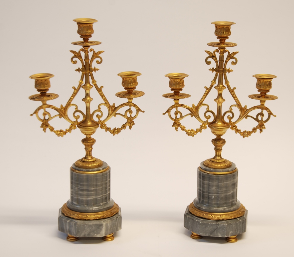 PAIR OF EARLY TWENTIETH CENTURY GILT BRONZE AND GREY VEINED MARBLE THREE LIGHT CANDELABRA`S, each